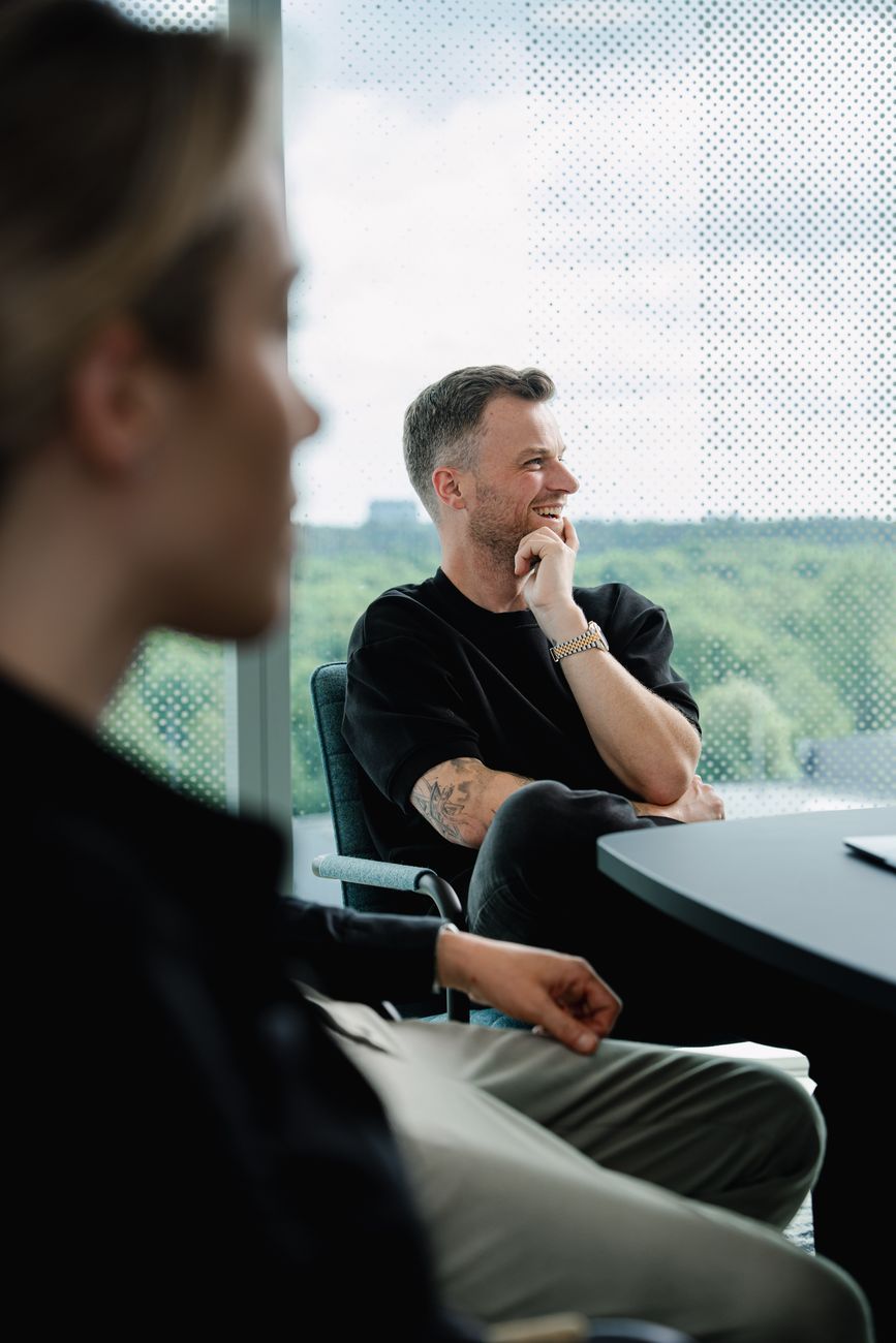Two colleagues talking in the InSpace office